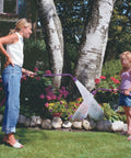 Woman and child using Sunrise Soft Rain Watering Spray Wand 30 Inch With Shut Off Valve Berry Color in garden