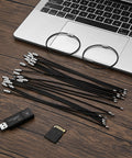 50 Pack Wire Keychain Cables Nylon Coated Stainless Steel Loop For Luggage Tags 2mm Thick 7.8 Inches Long Black on desk