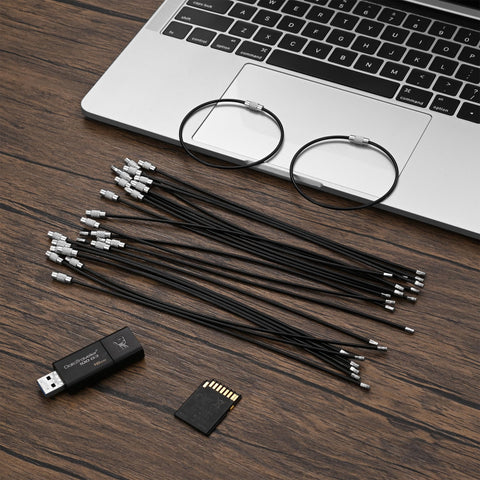 50 Pack Wire Keychain Cables Nylon Coated Stainless Steel Loop For Luggage Tags 2mm Thick 7.8 Inches Long Black on desk