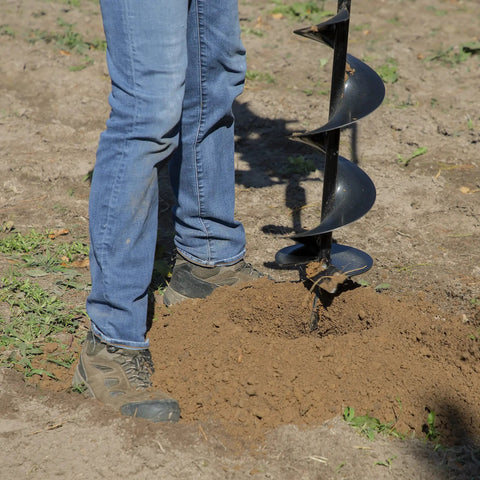 Person operating Earth Auger Combo With 52cc Two Cycle Powerhead And 8 Inch Auger Included Heavy Duty Handlebars