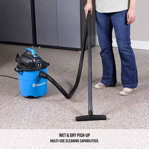 Person using Powerful 5 Gallon Wet Dry Shop Vacuum With 3 Peak HP Motor, includes 8 foot cord, on carpeted floor