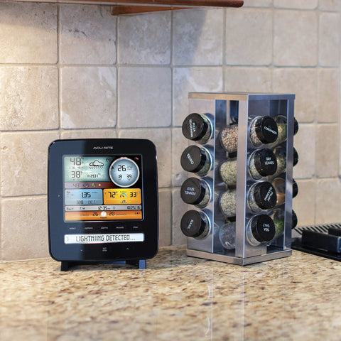 Iris Wireless Home Weather Station displayed on a kitchen counter with weather readings and lightning detection alert.