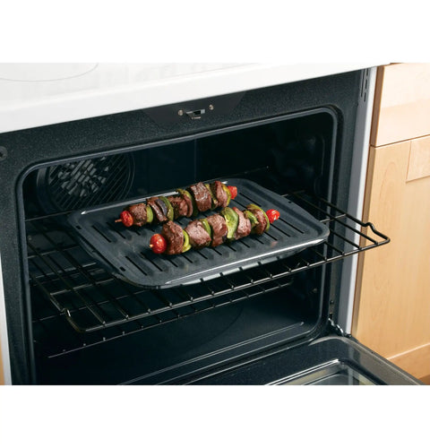 Universal Broiler Pan With Rack For Oven Nonstick Two Piece Black Porcelain Coated Carbon Steel Roasting Pan in use with kebabs