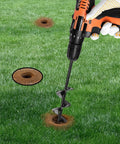 Hand holding drill with 2 Inch Diameter 9 Inch Length Auger Drill Bit For Fast Planting In The Garden Spiral Planter creating hole in grass