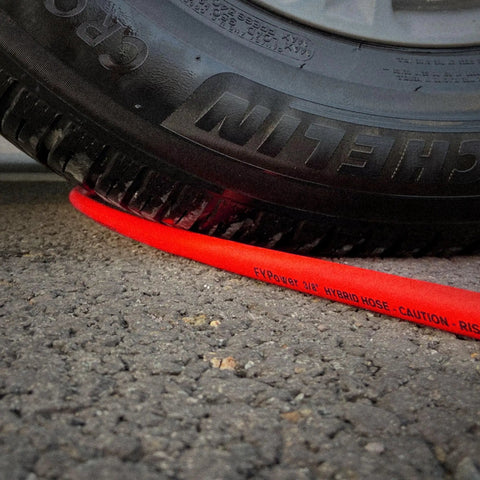 Three Eighths Inch By Six Foot Lead-In Air Hose For Compressors Under Tire Showing Flexibility and Resilience