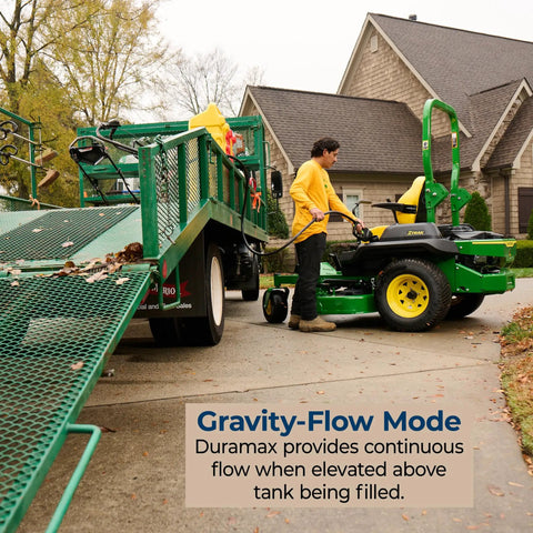 Duramax 14 Gallon Wheeled Diesel Fuel Transfer Tank With Spout Pump Yellow used to refuel lawn mower from trailer in driveway.