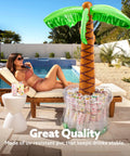 Inflatable Palm Tree Cooler, 60 Inch Tall, Beach Theme Pool Party Decor with drinks inside, by poolside with lounger in background.