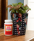 All In One Glue Sealer Finish Clear Gloss For Wood Paper Fabric And More, 8 oz bottle next to decorated pot with plant