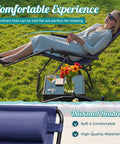 Woman relaxing on two blue zero gravity lounge chairs set with cup holders and pillows, no assembly needed, foldable outdoor patio recliners.