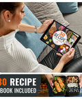 Woman reading tablet recipe ebook with Premium Bento Box With 2 Stackable Compartments, 40 Oz Capacity alongside, meals shown.