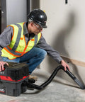 Worker using ProPack 4.5 Gallon Portable Wet Dry Shop Vacuum With Toolbox Design For Easy On The Go Cleanup 5.0 Peak HP Motor