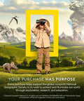 National Geographic Kids poster: child explorer with binoculars inside a yellow frame in a dinosaur-filled landscape