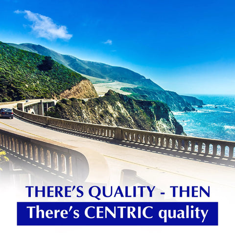 Centric C-Tek ceramic front brake pad set branding on a scenic coastal highway with blue sky and ocean