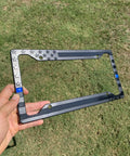 Subdued 3D Embossed American Flag License Plate Frame With Black Gloss On Matte Finish For Car Truck Or SUV Featuring Thin Blue Line