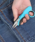 Person using 4.8 inch thread snips from Sewing Scissors Bundle Set For Quick Cuts And Precise Sewing, cutting denim fabric.