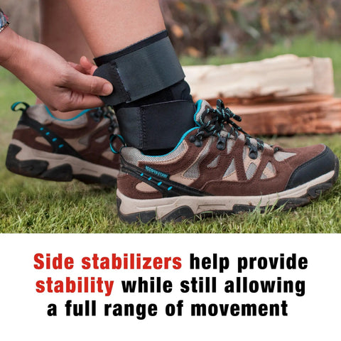 Person adjusting Deluxe Ankle Stabilizer With Adjustable Support In Black 1 Pack over hiking boots with side stabilizers