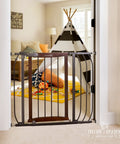 Walk Through Baby And Pet Gate With Walnut Wood And Charcoal Metal Accents displayed in doorway with kids' play area in background