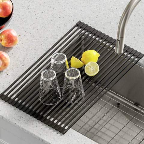 Over Sink Roll Up Dish Drying Rack Multipurpose Colander And Trivet Black Finish over sink with glasses and lemons