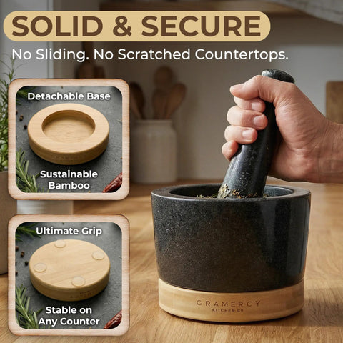 Hand using Mortar And Pestle Set Heavy Duty Granite Stone Grinder With Stable Bamboo Base Extra Long Pestle And Cleaning Brush Perfect For Guacamole Bowl Herb Grinding And Molcajete Bowl One Point Five Cup