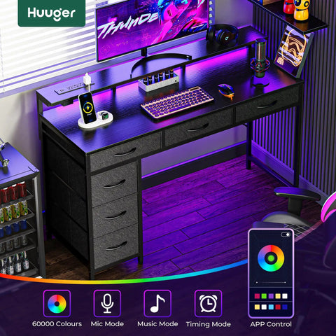 Gaming Desk With RGB LED Lighting And USB Type-C, 47 Inch Computer Desk With 6 Drawers in a home office setup, black.