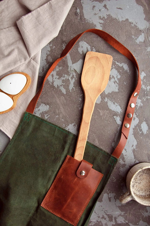 Monster 18 Inch Wooden Stir Paddle For Crawfish Boil Big Pots Heavy Duty Cajun Spatula in apron pocket next to coffee mug