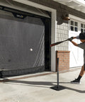 Player using 7 Foot Wide Baseball Softball And Golf Hanging Practice Net For Home Hitting Pitching And Driving Practice, Rolls Up Easily for Garage Storage.