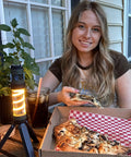 Person dining outside with Outdoor Mosquito Bug Repellent Lantern With USB C Rechargeable Camping Light Citronella Mats Included.