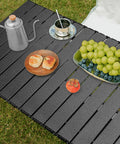 Folding Camping Table With Roll Up Top Height Adjustable Portable Metal Camp Table used for picnic with grapes and coffee set on top