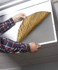 Person installing a 2x4 Fluorescent Light Covers For Classroom Ceiling Fixtures Beach Vibe 4 Pack, 22.38 Inches By 46.5 Inches