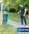 Man using 36 inch reacher grabber tool for outdoor trash pickup with safe and sanitary design in park setting.