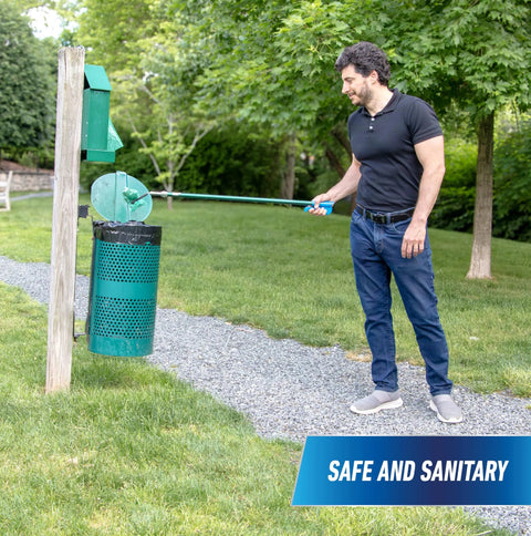 Man using 36 inch reacher grabber tool for outdoor trash pickup with safe and sanitary design in park setting.