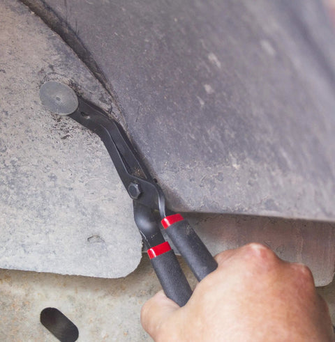 Auto Trim Clip Pliers With 45 Degree Angled Tips For Quick Fastener Removal In Tight Spots being used on vehicle panel.