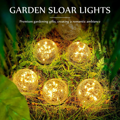 3.9 Inch Solar Globe Lights Outdoor Six Pack Waterproof Cracked Glass Balls For Lawn Patio Yard Backyard Decor Cozy Warm Yellow LED Glow Easy Install And Durable Design glowing in grass at night