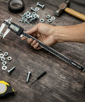 Hand using 12 Inch Electronic Digital Caliper With Extra Large Display, Quick Mode Change Between Inches Fractions And Millimeters