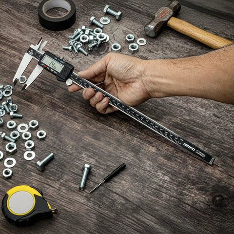 Hand using 12 Inch Electronic Digital Caliper With Extra Large Display, Quick Mode Change Between Inches Fractions And Millimeters