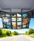 Ceiling Cargo Net With 3 Pockets And Double Layer Mesh Overhead Storage Organizer in SUV, showing packed items during a drive.