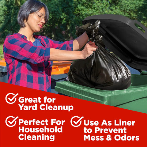 Person placing 65 Gallon Heavy Duty Trash Bags 50x60 Inches Extra Large Black Contractor Liners in green outdoor can
