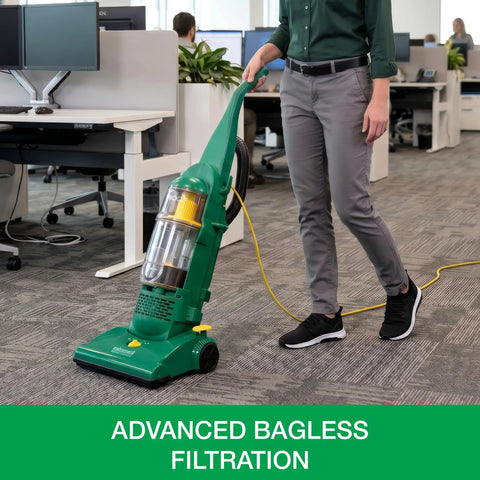Heavy Duty Bagless Upright Vacuum Chomping Debris On Carpets Hardwood Floors And Furniture With Beastly Suction Plus Onboard Tools And Commercial Filtering For Daily Grind Cleaning standing in office with cord.