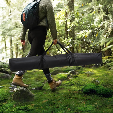 Person carrying Extra Large Hammock Storage Bag For Double Hammock And 12 Foot Steel Stand With Zipper Closure in a forest