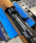 Heavy Duty Heat Resistant Magnetic Soft Jaws For Bench Vise Drill Press Clamps, blue jaws holding wooden rifle stock in a vise.