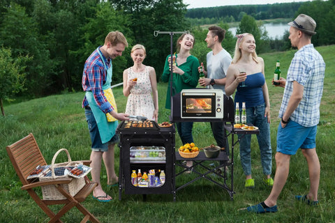 Group using All In One Camping Kitchen Station With Light Stand And Windshield Portable Foldable Grill Table in park
