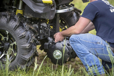 Man attaching Beefy 28 Inch ATV UTV Disc Plow Harrow With Universal 2 Inch Receiver Mount Delivers Deep Tillage Tight Turning And Efficient