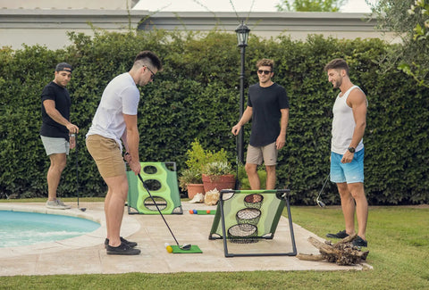 Group playing Backyard Golf Cornhole Game For Adults And Men near a pool, using foam balls and PVC tube frames for chipping practice.