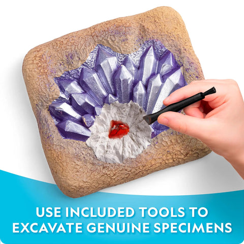 Person using a tool to excavate crystals from Gemstone Dig Kit For Kids With 15 Real Gemstones And Crystals Hands On Science Toy For Boys And Girls Gem Mining Kit Educational Rock Collection Gift For Curious Kids And Nature Lovers.