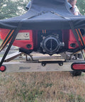 Two Pack 2 Inch Retractable Ratchet Straps With Storage Bag securing a boat on a trailer