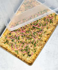 Extra Large High Sided Baking Pan With Lid For Big Batches Uncoated Aluminum Sheet Pan with cooked dish inside