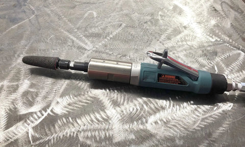 Zirconia Alumina Round Tip Grinding Cone Z20 S Portable Heavy Duty Tool with open cutting face attached to grinder on metal surface