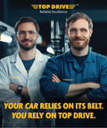 Two mechanics wearing safety glasses and uniforms in a workshop with a slogan about reliability on the wall.