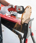 One Ton Clamping Force Portable Material Support Station With Hands Free Holding Non Marring Jaws Red Black Steel Workbench in use