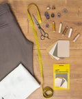 Premium Quality Fabric Iron On Patches Kit With Ultra Strong Glue, 12 Patches In Shades Of Brown Beige And Khaki on wooden table